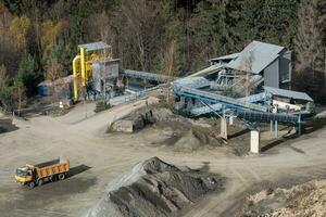 Truck and mining equipment in the quarry. Industrial stone quarrying. photo