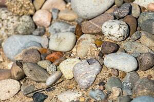 Natural background with stones on the sand photo