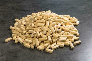Tablets vitamins with a source of nutrients for vegetarians and lovers of healthy lifestyle photo