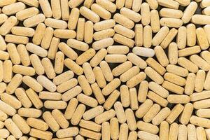 Tablets vitamins with a source of nutrients for vegetarians and lovers of healthy lifestyle photo