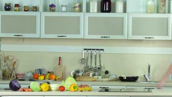 Girlfriends gather in the kitchen to prepare a salad video