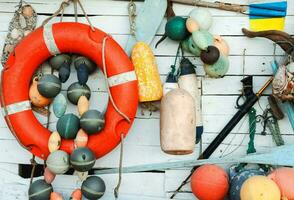 various fishing items are displayed on a wall photo