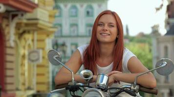 Portrait of young girl sitting on scooter video