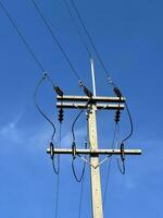 electric pole with blue sky background photo