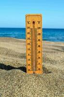 a thermometer on the beach photo