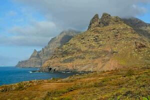 the mountains are very tall and rocky photo