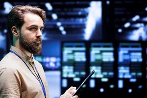 Meticulous IT programmer setting up high tech facility advanced cybersecurity firewalls and intrusion detection systems. Adept serviceman preventing hacking, malware, and denial of service attacks photo