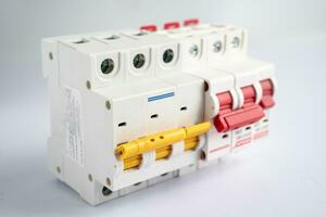 Automatic circuit breaker on white background, control and protect electrical power system. photo