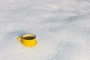 Coffee in a cup on the background of a winter theme photo