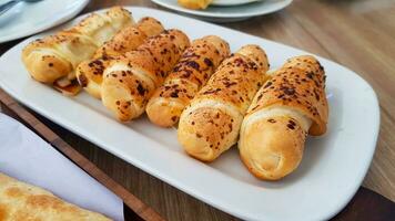 Delicious baked cheese rolls, baked crunchy cheese bread on an catering event, selected focus, cheese wrapped in bread and baked photo