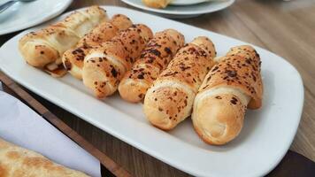 Delicious baked cheese rolls, baked crunchy cheese bread on an catering event, selected focus, cheese wrapped in bread and baked photo