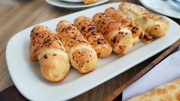 Delicious baked cheese rolls, baked crunchy cheese bread on an catering event, selected focus, cheese wrapped in bread and baked photo