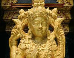 Balinese Hindu God golden Shiva Durga statue on a sacred Hindu temple in Indonesia photo