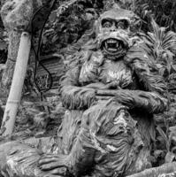 Stone monkeys statues in sacred monkey forest. Old decorative monkey sculptures in Bali ubud sacred forest photo