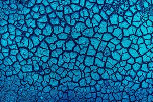 Earth with cracks top view for background or graphic design of textures and overlays with the concept of drought and death. photo