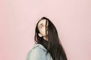 Studio portrait of stylish young woman. Beauty, fashion, seasonal vogue style weeks concept photo