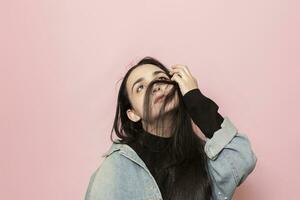 Studio portrait of stylish young woman. Beauty, fashion, seasonal vogue style weeks concept photo