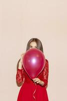 young  and beautiful woman holds air balloons. valentines day, birthday, womens day, anniversary, holiday celebration concept photo