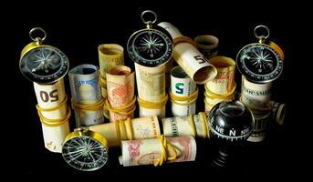 money rolls with a compasses on them photo