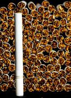 a cigarette is surrounded by many cigarettes photo