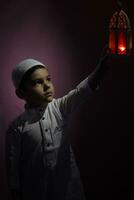 Praying muslim boy photo