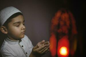 Praying muslim boy photo