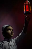 Praying muslim boy photo