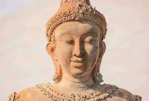 a close up of a buddha statue photo