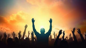 Silhouette of a group of people raising their hands in the air, human rights day photo