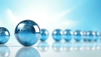 blue glass globe in front of a group of silver balls photo