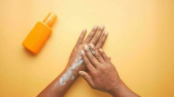 young men using sunscreen cream video