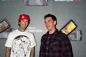 Travis Barker  DJ AM arriving at the  TMobile Sidekick LX Launch Event at  Paramount Studios inin Los Angeles CA on May 14 2009 photo