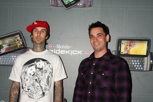 Travis Barker  DJ AM arriving at the  TMobile Sidekick LX Launch Event at  Paramount Studios inin Los Angeles CA on May 14 2009 photo