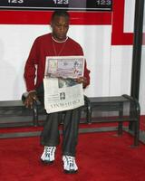 Tommy Davidson arriving at the Premiere of The Taking of Pelham 123 at the Mann Village Theater in Westwood CA   on June 4 2009 photo