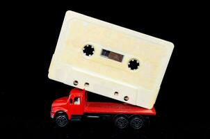 a red truck with a cassette on top photo