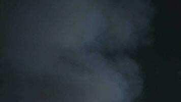 Smoke on dark background. Realistic atmospheric gray fog haze cloud. video