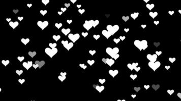 vit hjärta täcka över på svart bakgrund. hjärtan upp vfx effekt. video