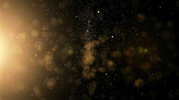 Gold particles falling on black background in Slow Motion Animation. Shiny Christmas golden lights 4K. video