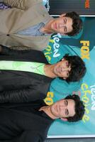 Jonas Brothers arriving at the Teen Choice Awards 2009 at Gibson Ampitheater at Universal Studios Los Angeles CA on August 9 2009 photo