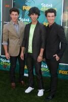 Jonas Brothers arriving at the Teen Choice Awards 2009 at Gibson Ampitheater at Universal Studios Los Angeles CA on August 9 2009 photo