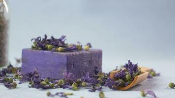 Homemade natural soap bar and lavender flower on table video