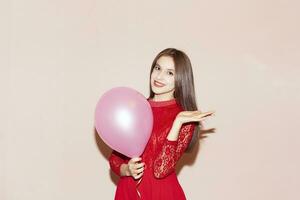 pretty woman holds air balloon. valentines day, birthday, womens day, anniversary, holiday celebration concept photo