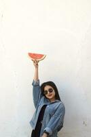 Beautiful young girl eating watermelon. Summer girl. photo