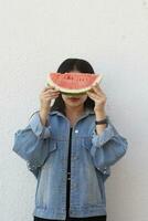 Beautiful young girl eating watermelon. Summer girl. photo