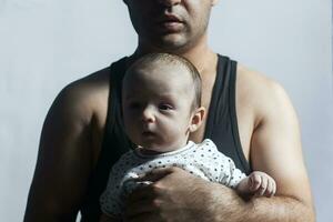 Adorable father and child. A brutal view of father and newborn kid baby boy photo