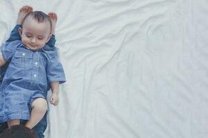 Happy childhood concept. Happy brothers portrait. 6 years and 6 months old boys having fun. Two little kids smiling having good time. Cute little brothers lying and playing together photo