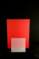 a red card with a white square on it photo