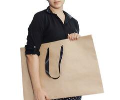 Happy girl with shopping bags isolated on white photo