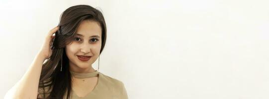 Portrait of a beautiful middle-eastern girl. Young attractive female looking into the camera and smiling. photo