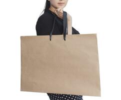 Happy girl with shopping bags isolated on white photo